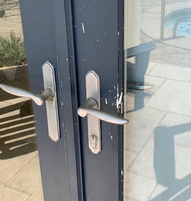 paint splatter cleanup on a glass patio door