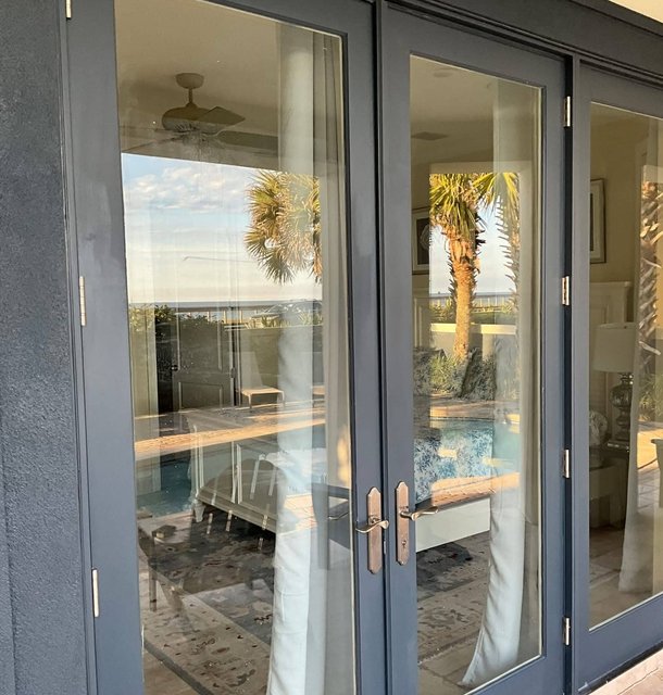 clean glass patio doors at a beachfront rental